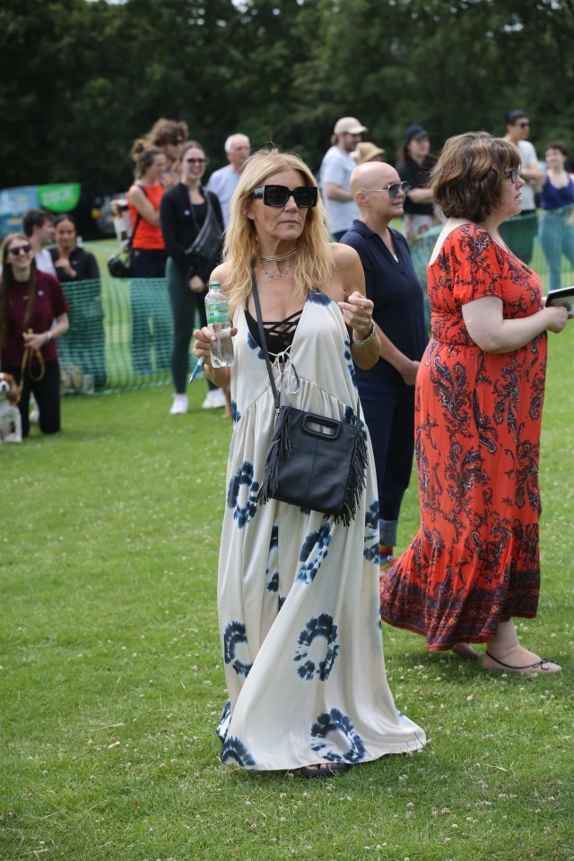 Her dress was covered in tie-dye circles and she added to her boho vibe with a straw hat