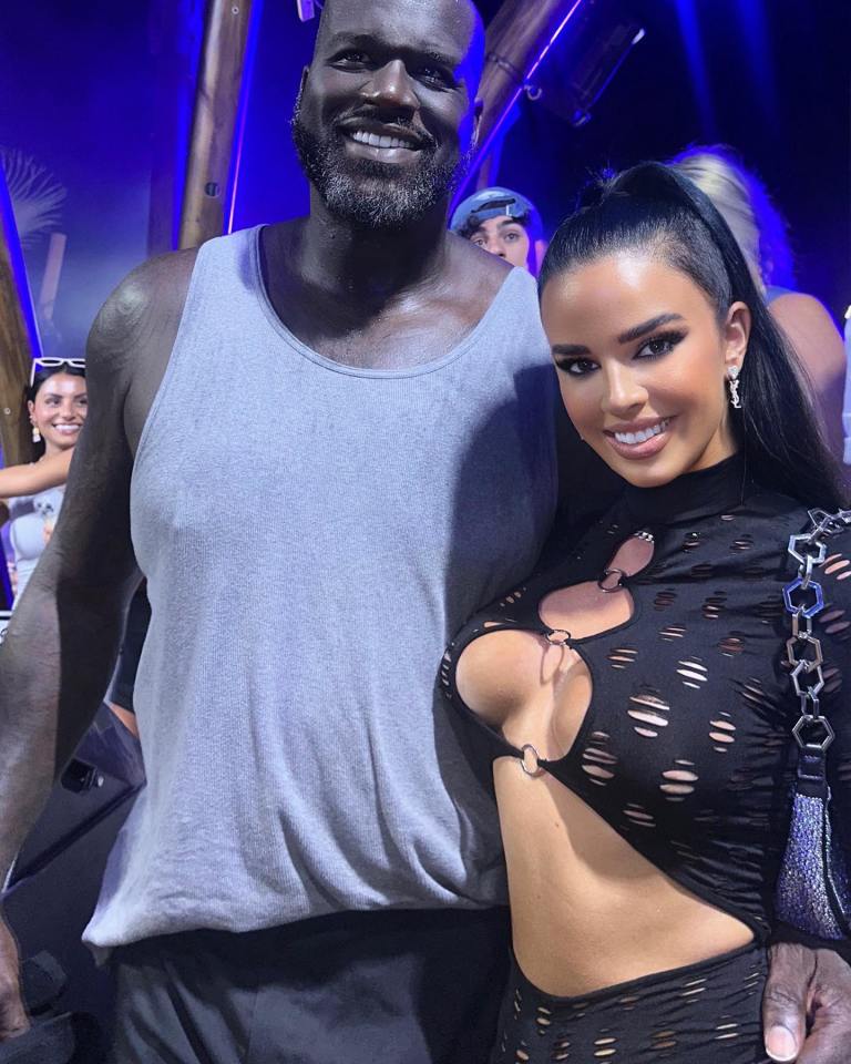 a man and a woman are posing for a picture together