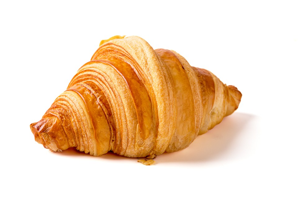 A croissant on a white background.