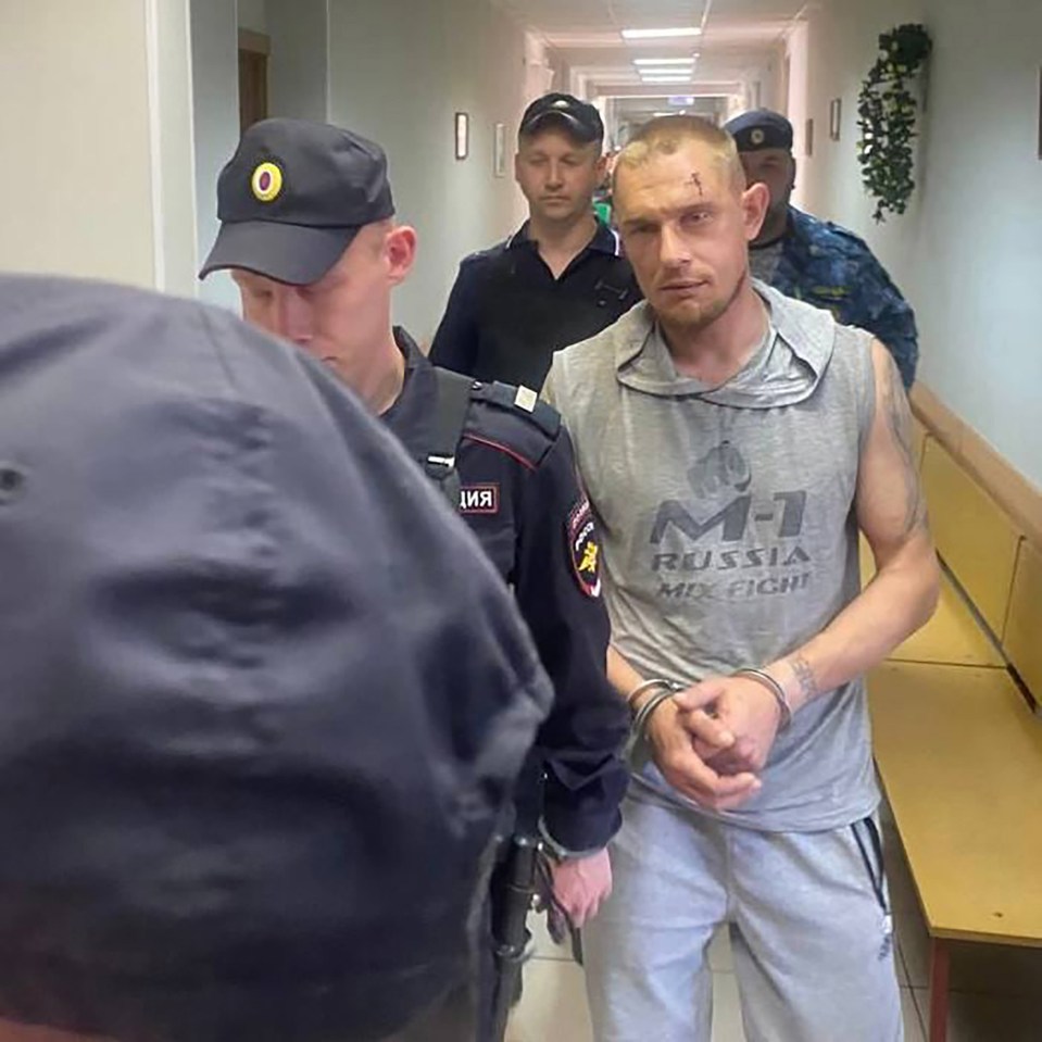 Igor Sofonov, 38, is perp walked to his cell