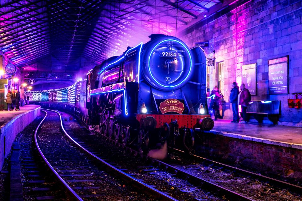 The trains are covered in lights both inside and out for the journey