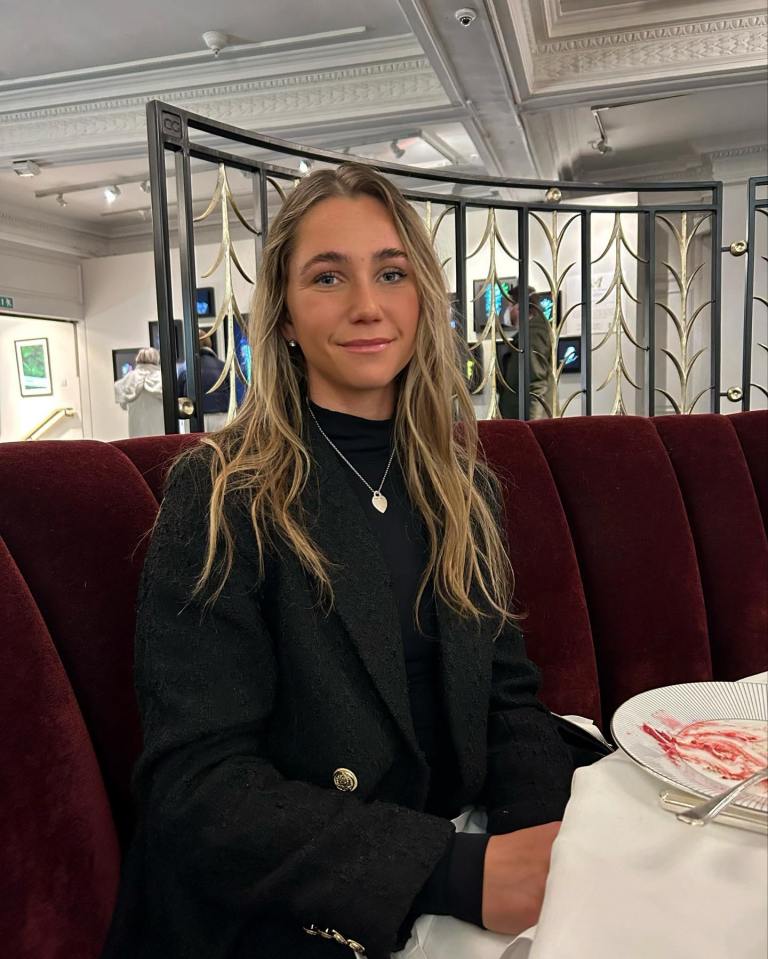Olivia Peet, a British tennis player, sitting at a restaurant table.