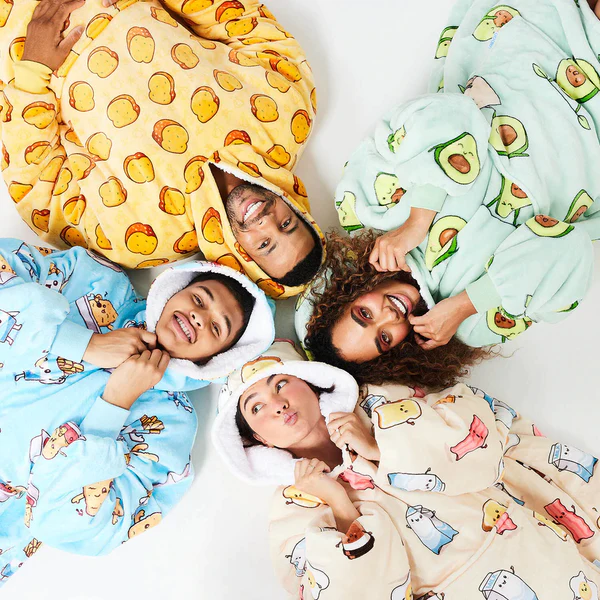 a group of people wearing blankets with avocados on them