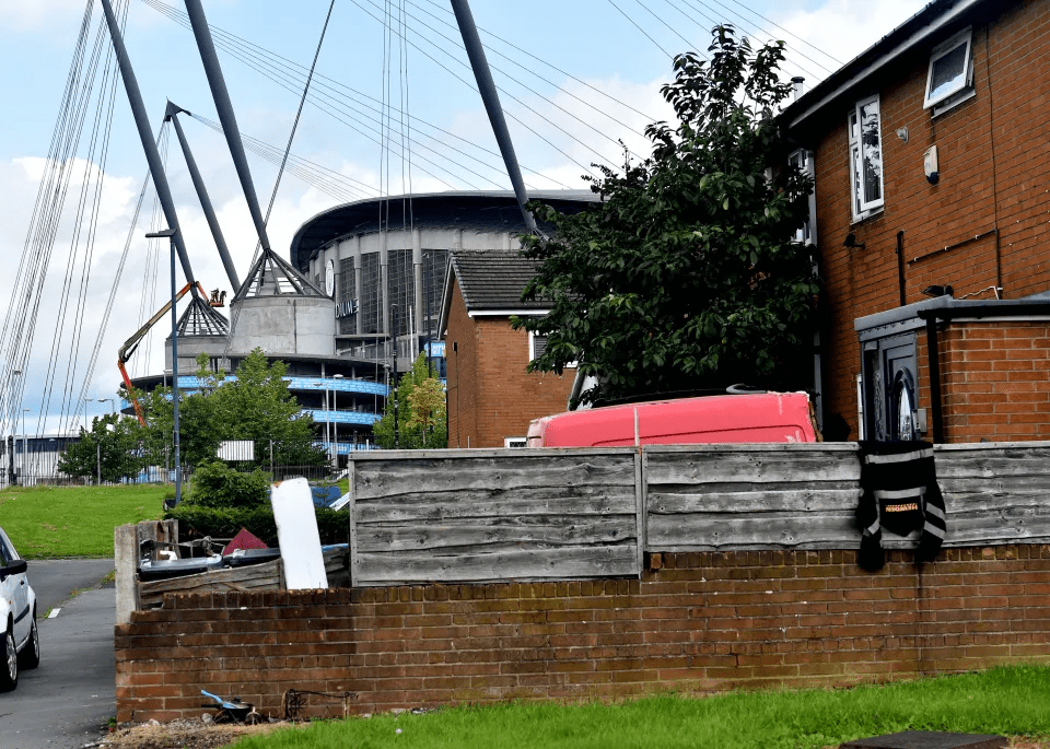 Locals are leading an exodus from a neglected estate next to reigning Premier League and European champions Manchester City's Etihad Stadium