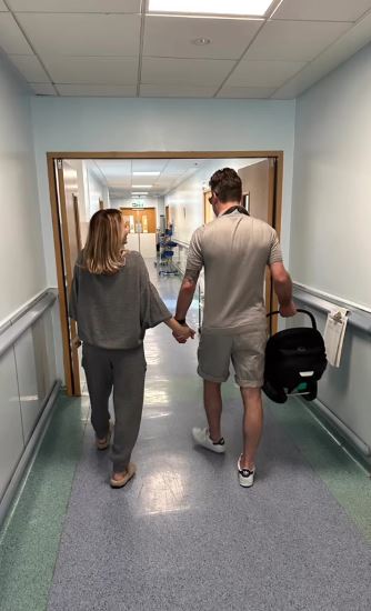 The pair lovingly held hands as they exited the hospital after the birth of their daughter