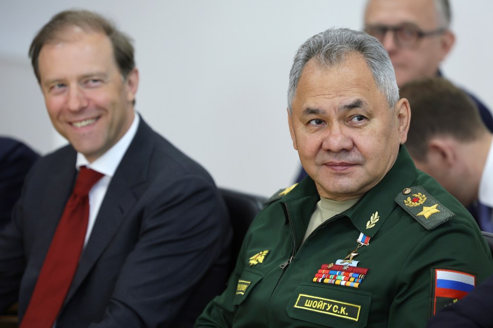 Russian Defense Minister Sergei Shoigu, right, and Deputy Prime Minister Denis Manturov also attended the meeting