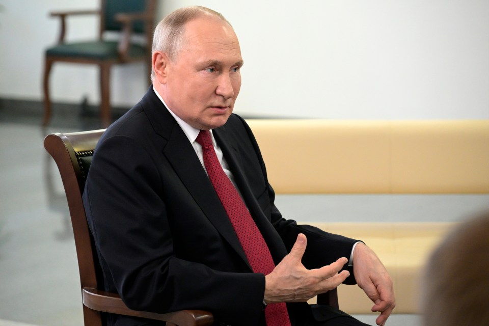 Vladimir Putin gesturing while speaking.