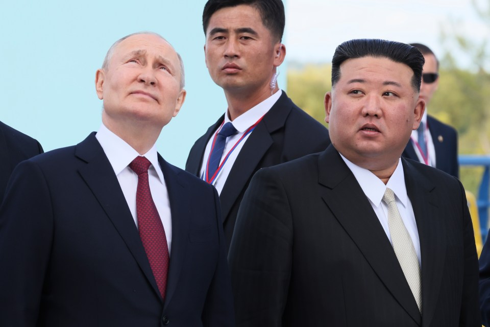 Putin and Kim examine a launch pad of Soyuz rockets during their meeting