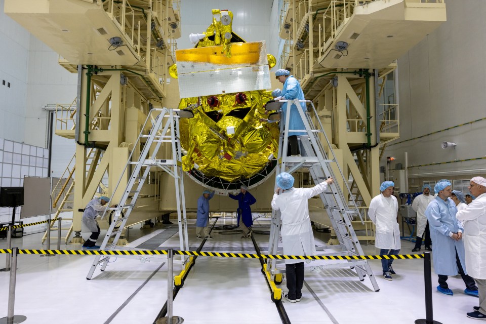 Specialists take part in preparations ahead of the launch of Russia's lunar landing spacecraft Luna-25 mission