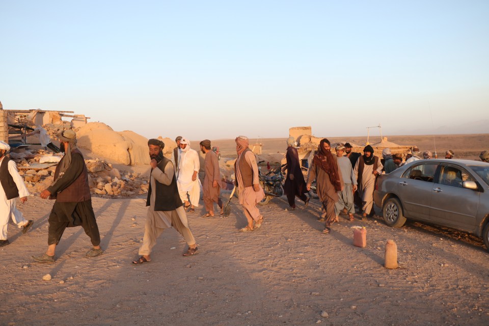 People affected by the quakes wait for relief in Herat, Afghanistan