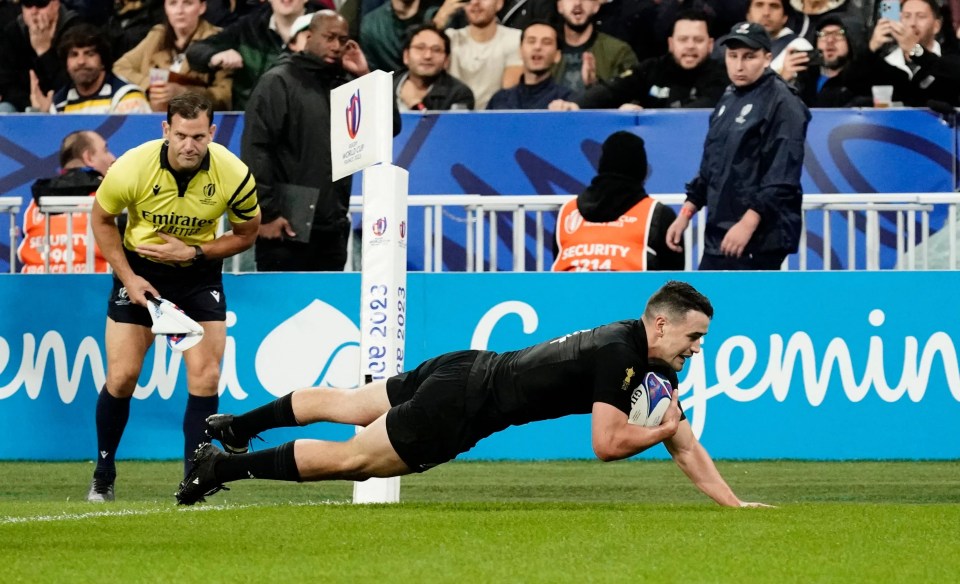 Will Jordan dives over his his second and the All Blacks' sixth try