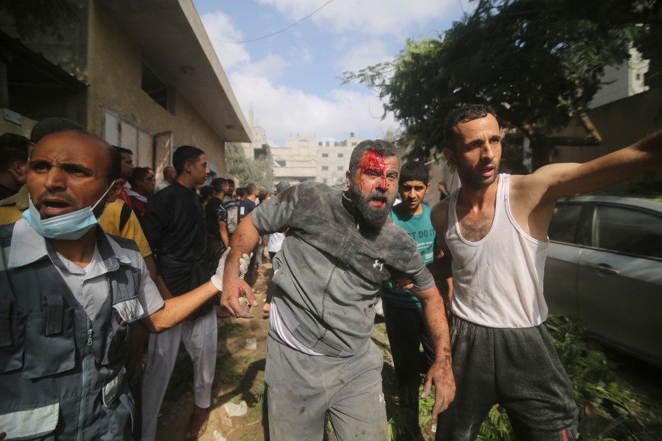 Palestinians are evacuated from buildings hit in the Israeli bombardment of the Gaza Strip in Rafah, Sunday, Oct. 22, 2023. (AP Photo/Hatem Ali)
