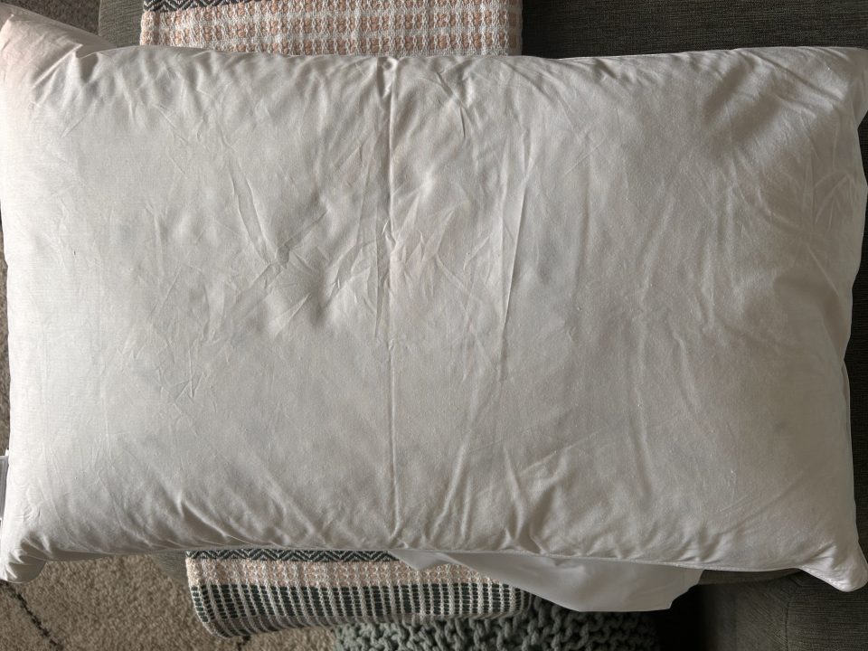 A white pillow on a white background.