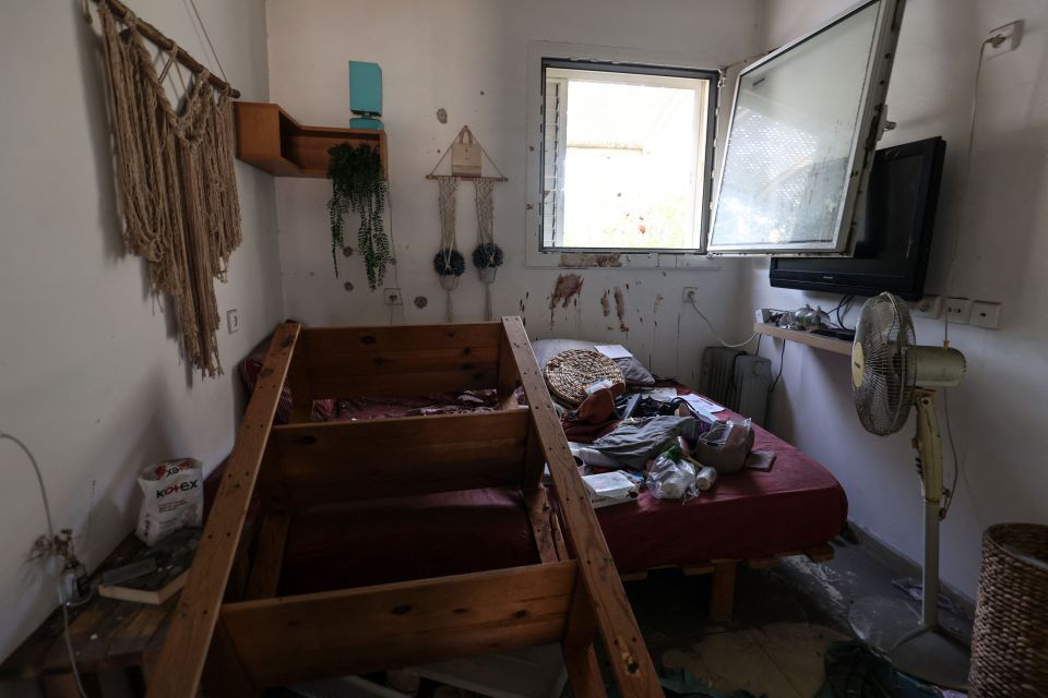 Blood is seen on the walls of a room inside the Kfar Aza Kibbutz where dozens of Israelis were massacred