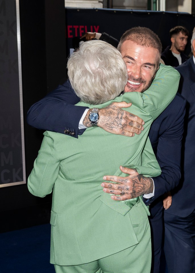 David embraced his mum who sported a green suit