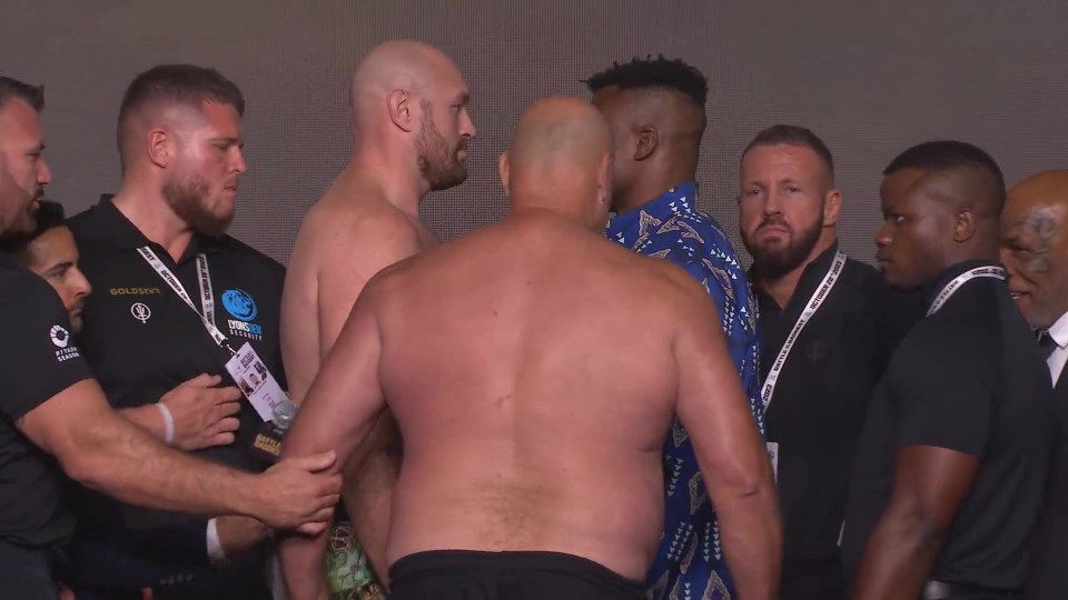 Security had to pull the 59-year-old away from blocking the camera's view
