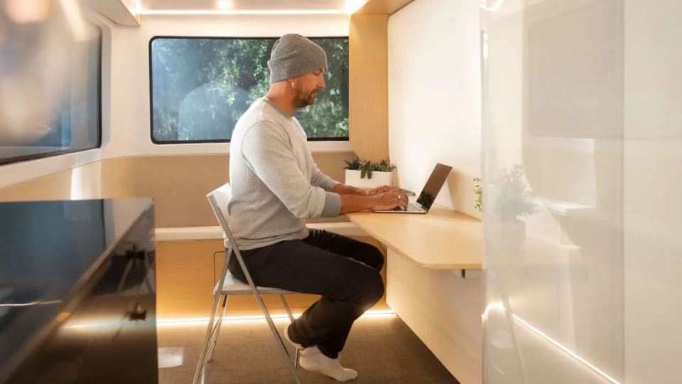 The EV boasts a flip-down desk