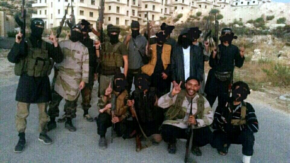 Aine Davis (bottom right) posing with a group of suspected ISIS fighters