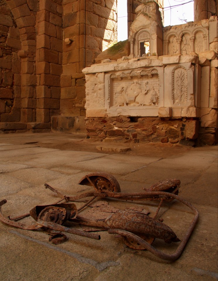 The remains of a pram in the church of the martyred village of Oradour sur Glane