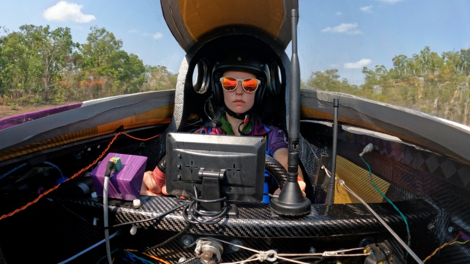 The car has no air con as it races ahead in 40C heat