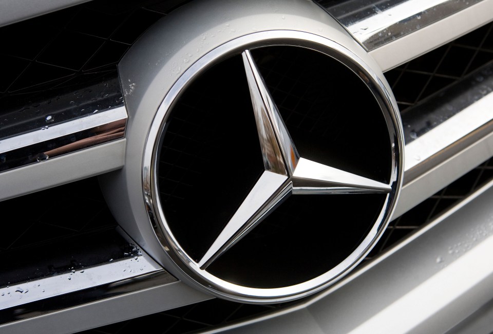 Mercedes-Benz emblem on a car grill.