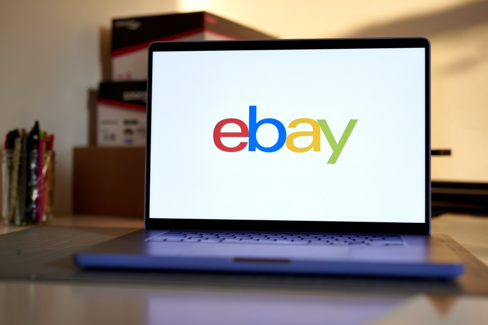 a laptop with the ebay logo on the screen