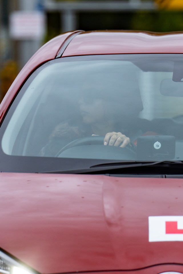 Jesy was seen learning to park in a red Toyota Yaris