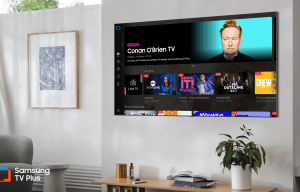 a samsung tv plus is mounted on a wall