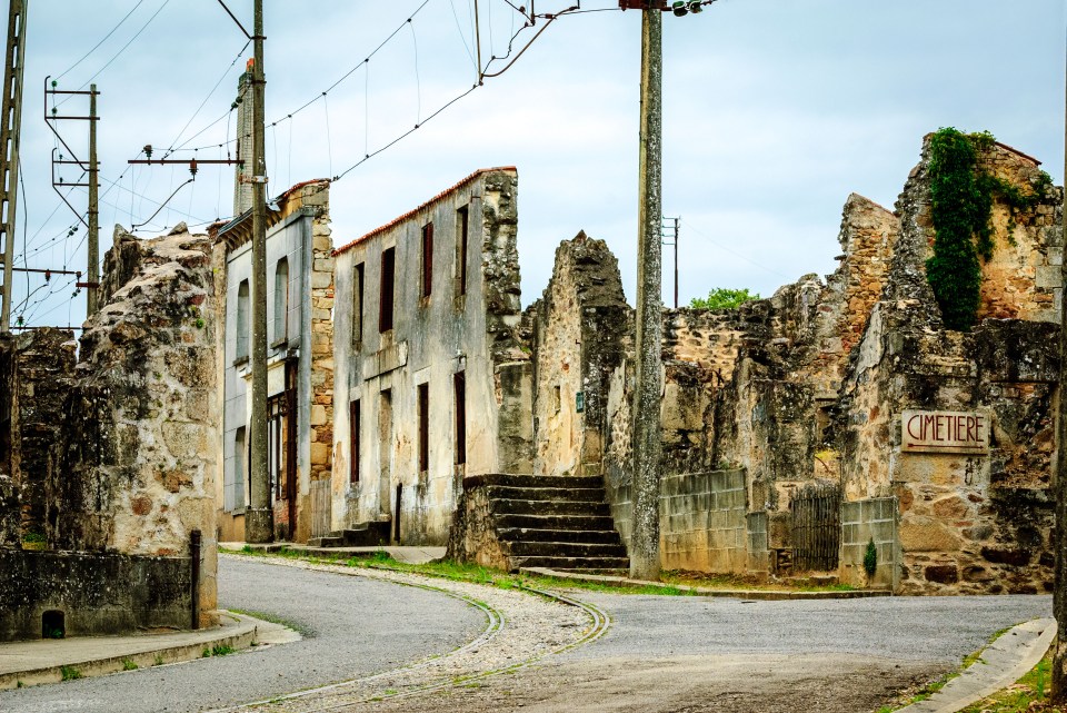The burned-out shells of buildings still stand in this wrecked village frozen in time