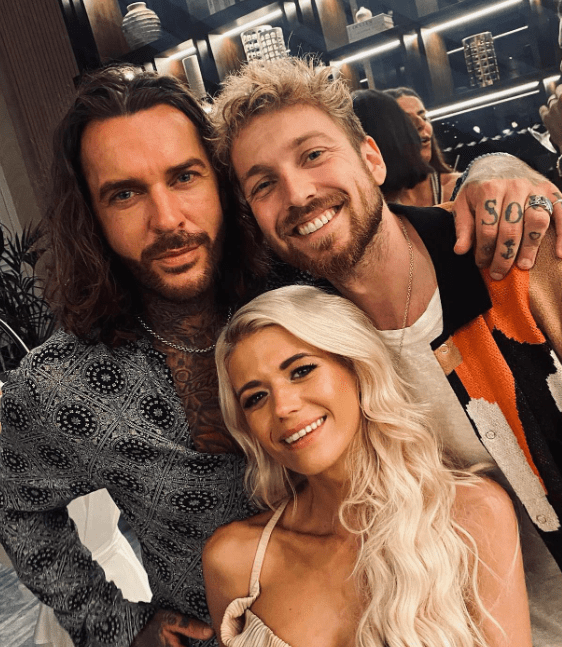 Pete Wicks and best pal Sam Thompson cuddle up to Danielle Harold at the wrap party