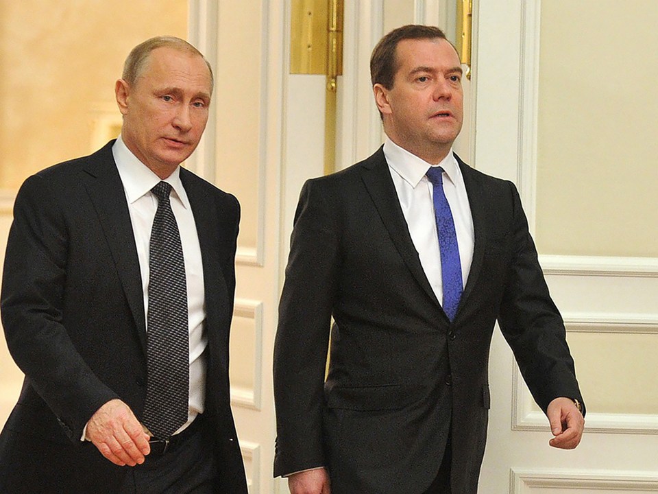 Former Russian president Dmitry Medvedev, right, warns the world hasn't been closer to a nuclear World War Three since the Cuban Missile Crisis