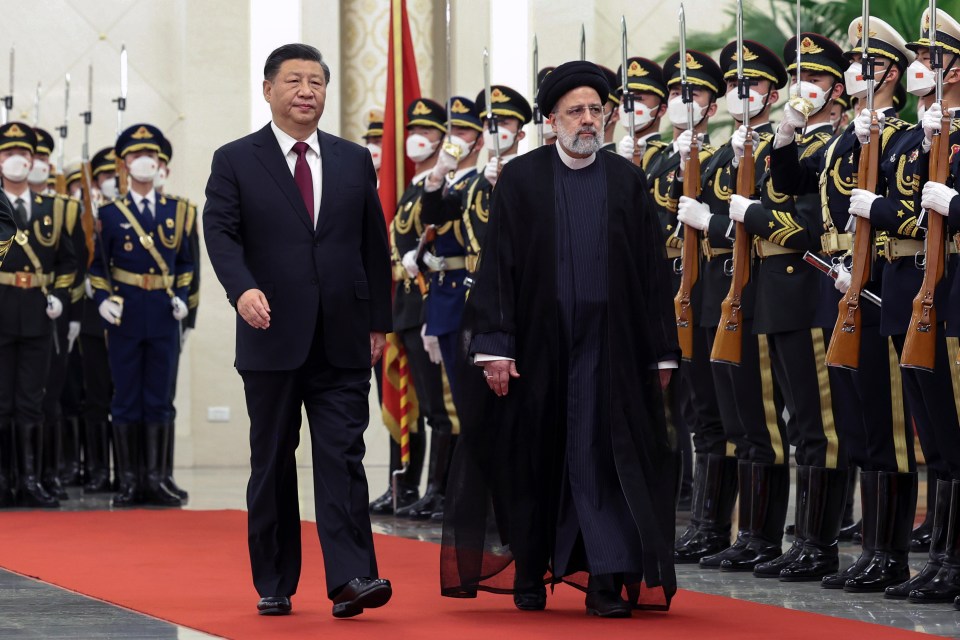 Iranian President cosying up to China's Xi Jinping last February