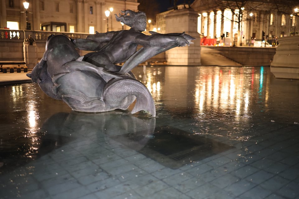 Fountains in Trafalgar Square have frozen over during sub zero temperatures in central London