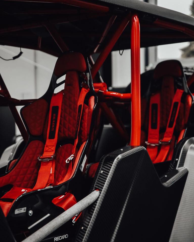 The dune buggy-style vehicle features leather seats
