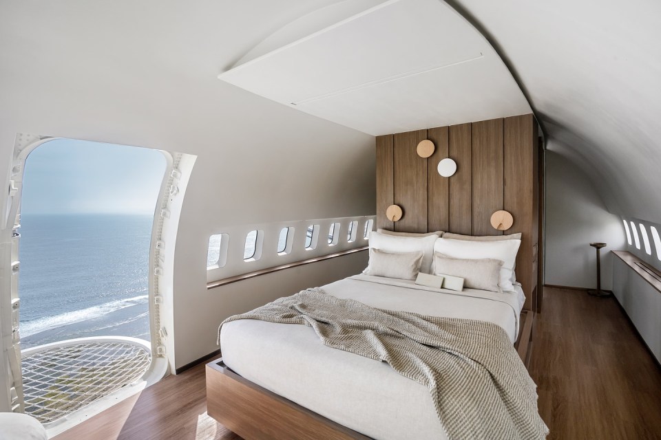 One of the bedrooms includes an open cargo door window seat - with safety netting