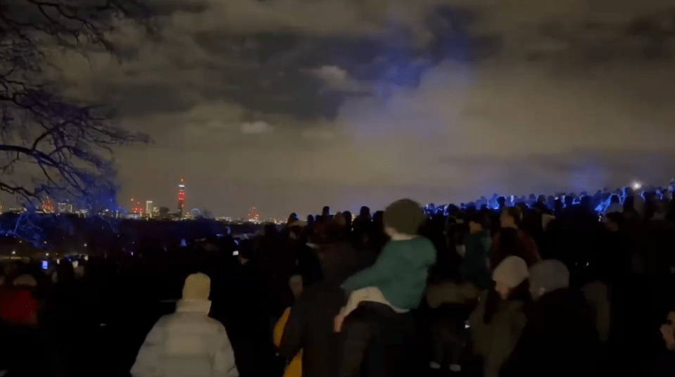 Blue lights were seen among the crows as cops arrived at the scene