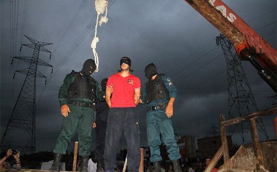 Victims are hoisted up by a crane attached to their noose until they choke to death