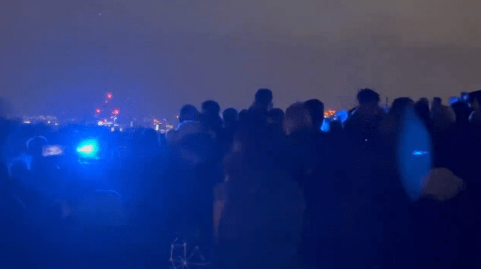 Onlookers watched in shock as police responded to calls in the area