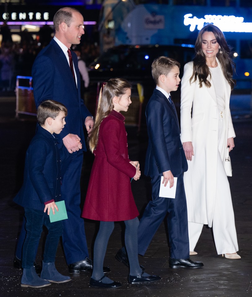 Prince William, Kate Middleton, and their three children walking together.
