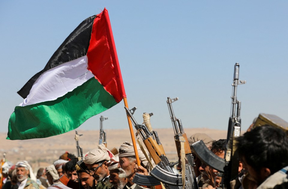 Yemen’s Houthis, pictured waving a Palestinian flag and holding up their firearms, have aligned with Hamas