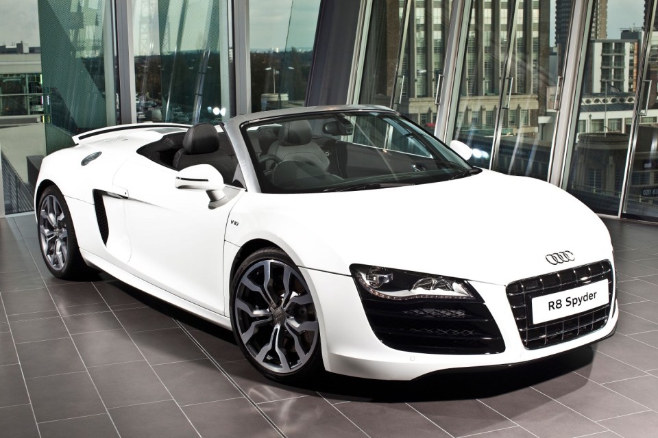 D3296K White Audi R8 Spyder in car showroom, Richmond, England, UK