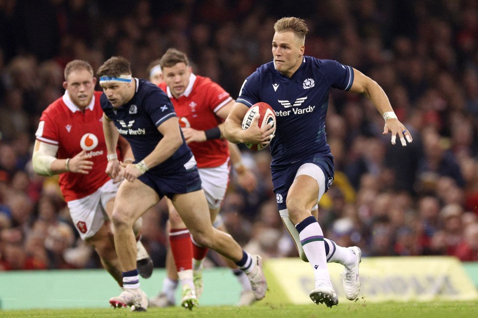 CARDIFF, WALES - FEBRUARY 03: Duhan van der Merwe of Scotland breaks with the ball to score his team's third try during the Guinness Six Nations 2024 match between Wales and Scotland at Principality Stadium on February 03, 2024 in Cardiff, Wales. (Photo by Warren Little/Getty Images)