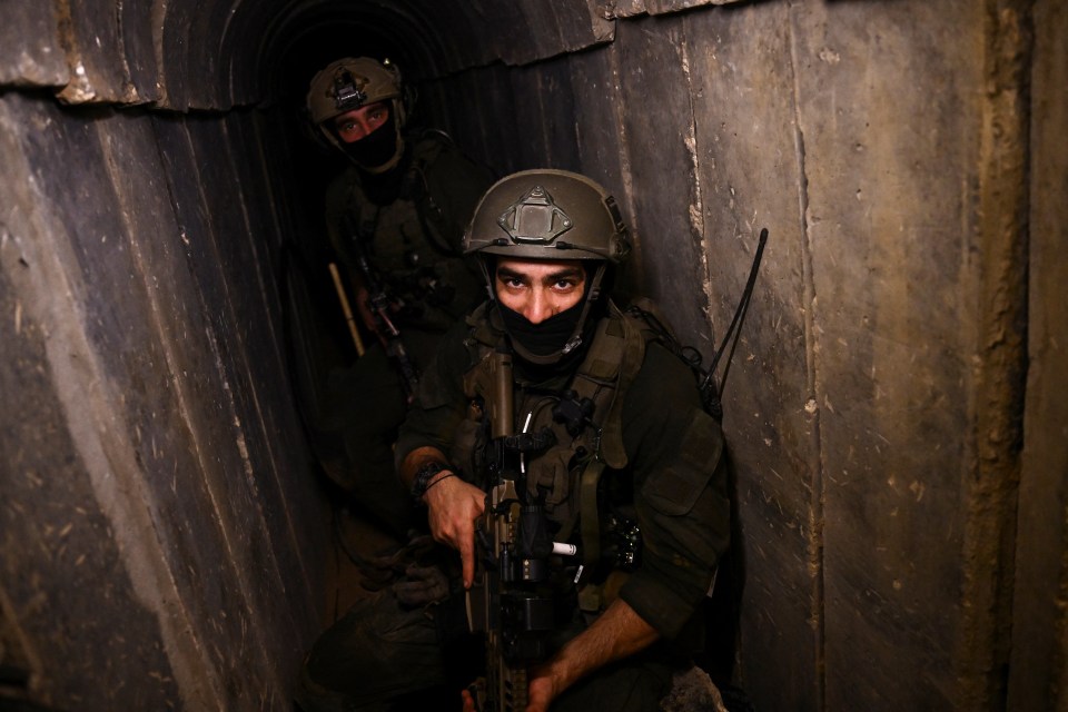 Israeli soldiers operate in what the military described as a Hamas command tunnel running partly under UNRWA headquarters, amid the ongoing conflict between Israel and the Palestinian Islamist group Hamas, in the Gaza Strip, February 8, 2024. REUTERS/Dylan Martinez EDITOR'S NOTE: REUTERS PHOTOGRAPHS WERE REVIEWED BY THE IDF AS PART OF THE CONDITIONS OF THE EMBED. NO PHOTOS WERE REMOVED