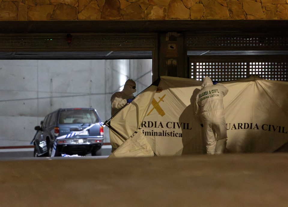 Spanish police investigate the garage where Kuzminov's body was found