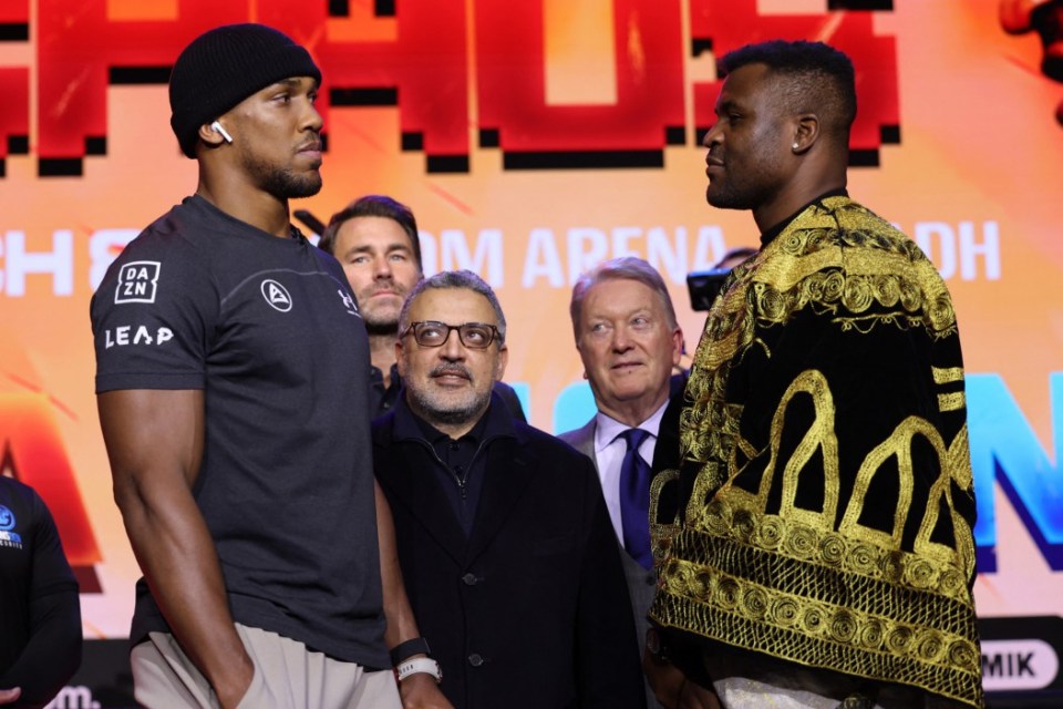 British heavyweight boxer Anthony Joshua (L) and French-Cameroonian boxer Francis Ngannou (R) pose after a press conference in London on January 15, 2024, ahead of their fight in March. (Photo by Daniel LEAL / AFP) (Photo by DANIEL LEAL/AFP via Getty Images)