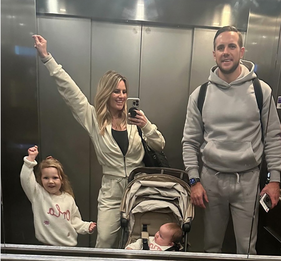 The family of four posed for a picture together in a lift
