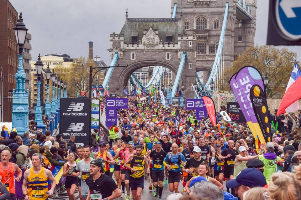Thousands of runners crossing Tower Bridge during the London Marathon.
