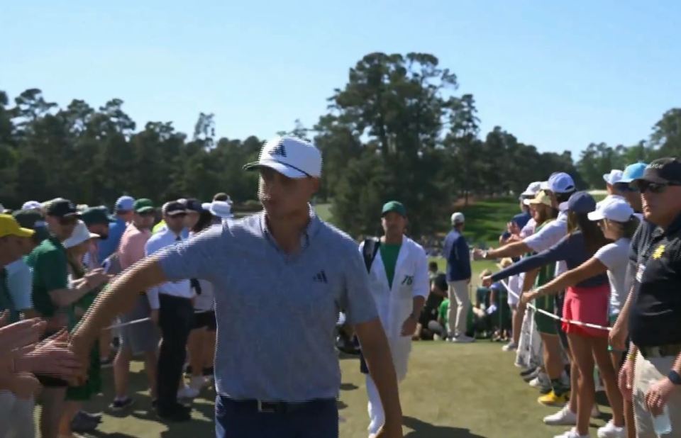 Ludvig Aberg high-fived patrons after the ninth hole