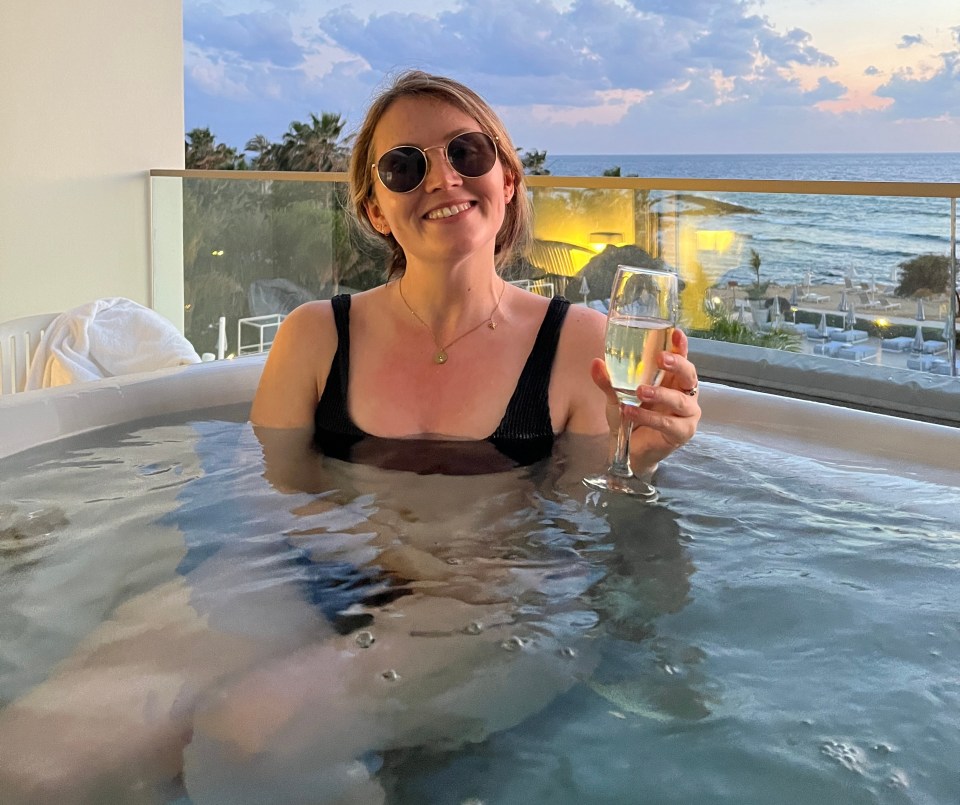Kara in the hot tub on the private balcony of her room
