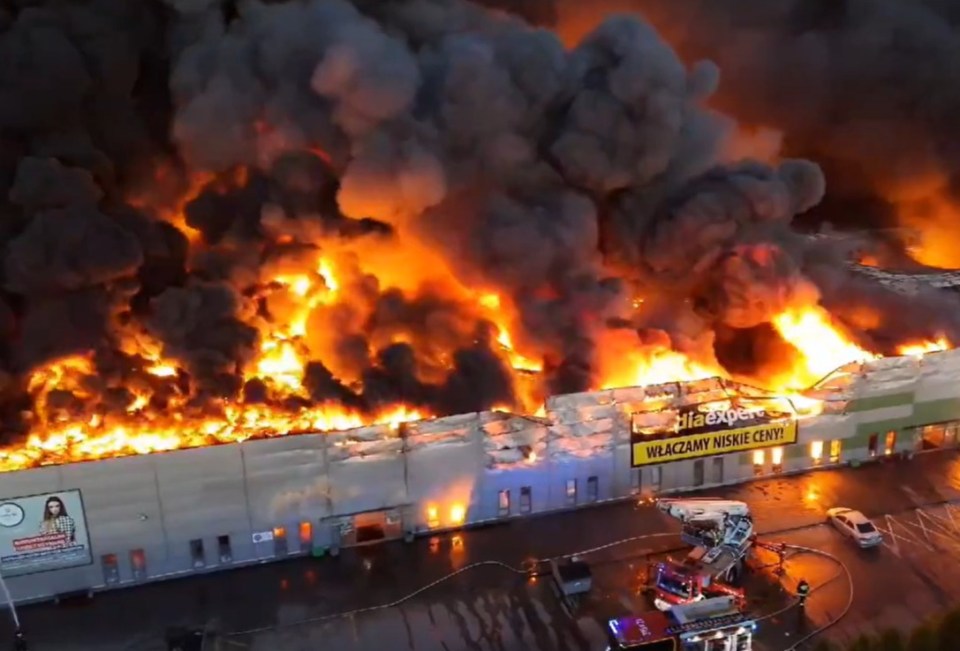 Large building engulfed in flames.